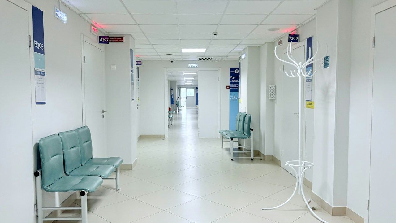 Hospital corridor with seating and doors