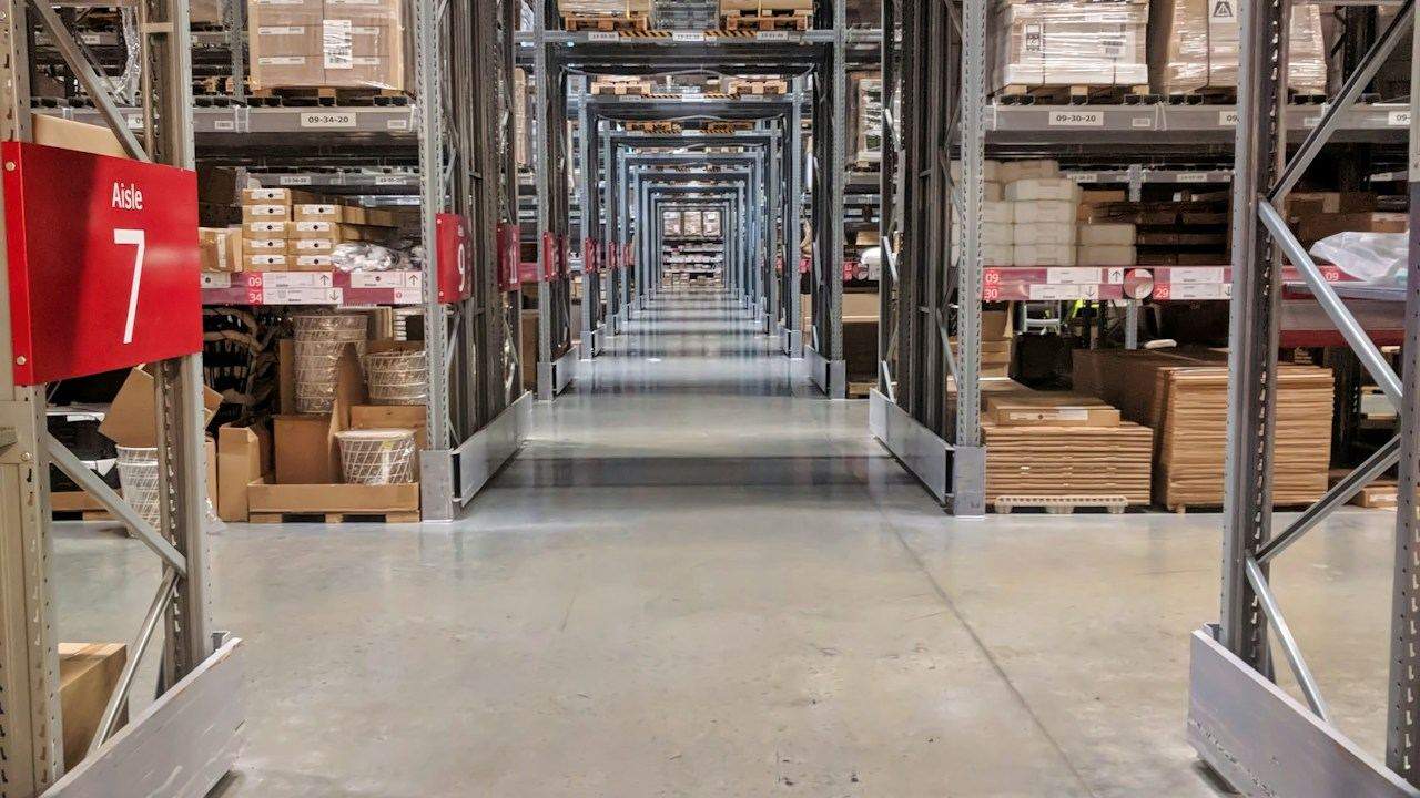 Warehouse aisles with organised stock on shelves
